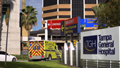 tampa general hospital emergency department signage on main campus with ambulance on road