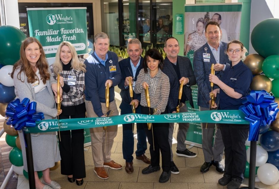 A group of Tampa General Hospital and Wright's Gourmet House executive cut a green ribbon to open the first-ever satellite location of the iconic Tampa, Fla. bakery.