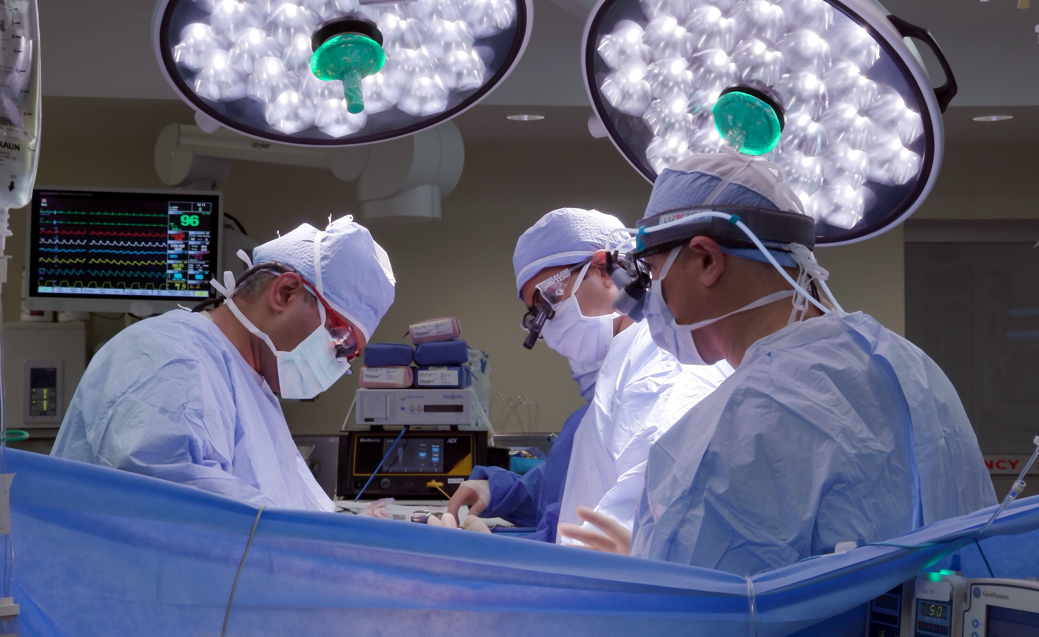 Kiran Dhanireddy, from left, Dr. Vijay Subramanian and Dr. Lucian Lozonschi complete the first combined heart-liver transplant 