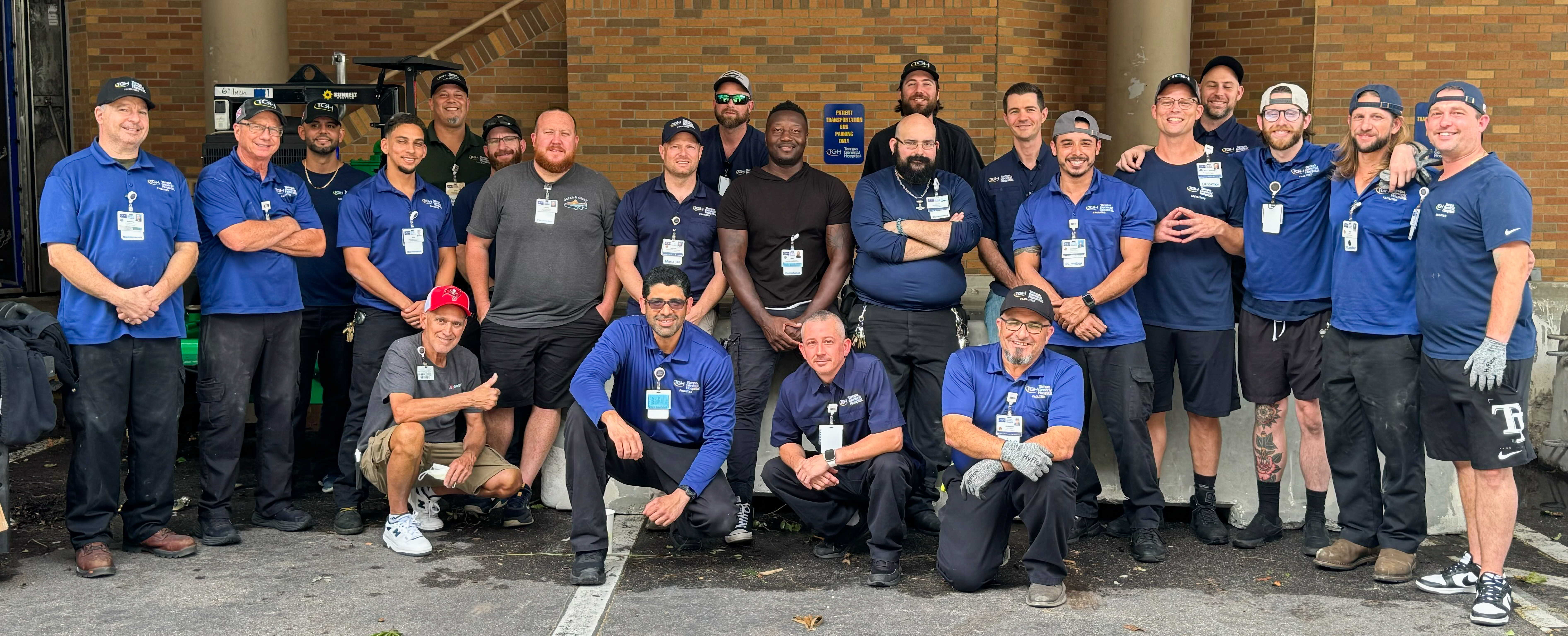 A group of people who have helping prepare for the hurricane smiling for a photo