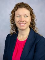 dr. asa oxner headshot in professional attire