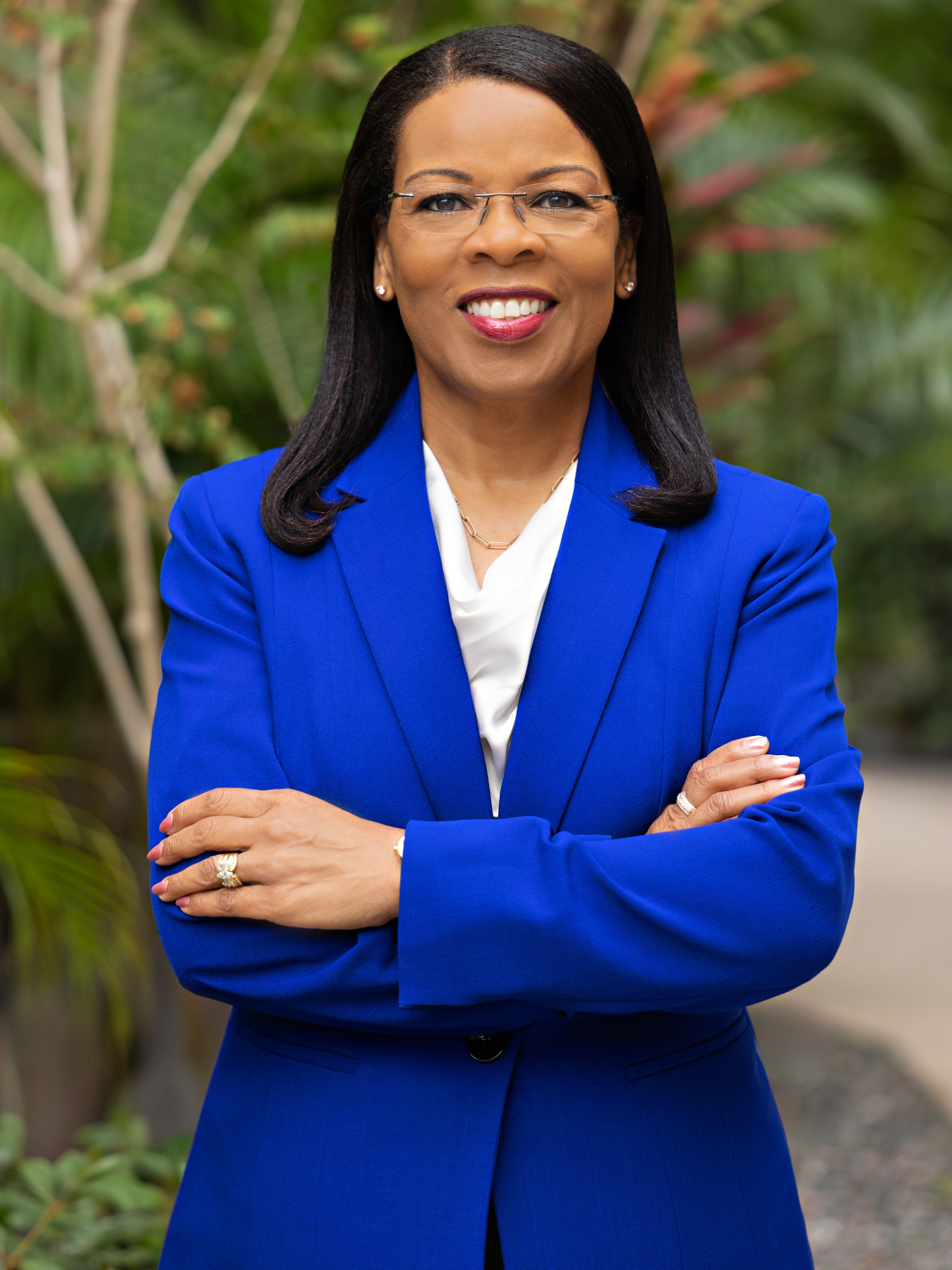 headshot image of Wendi Goodson-Celerin, DNP, APRN, NE-BC with tgh garden in background