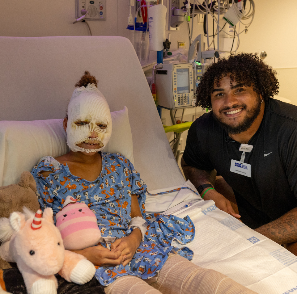 Tristan Wirfs visiting with a Muma Children's Hospital patient during the holidays last year. 