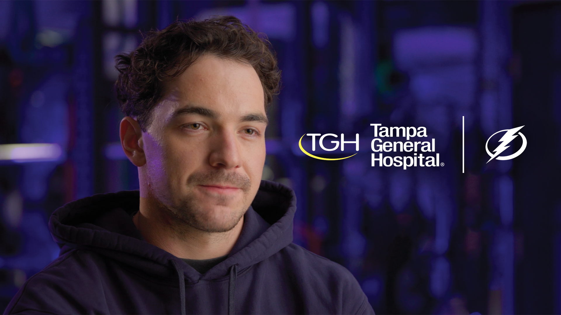 mikey eyssimont in tampa bay lightning training room for interview with tampa general hospital