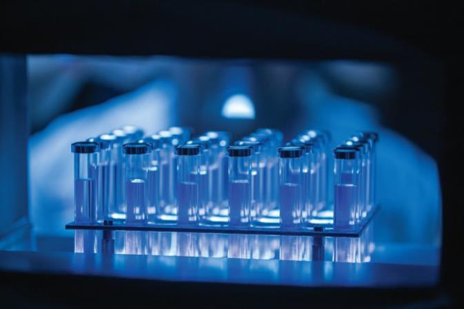 medical viles filled with liquid in a rack