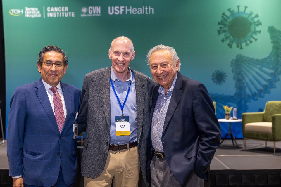 A photo of three doctors in business attire.