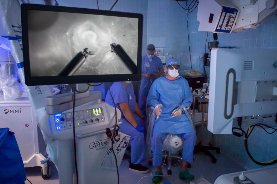 dr. nicholas panetta and team using the symani surgical system in an operating room