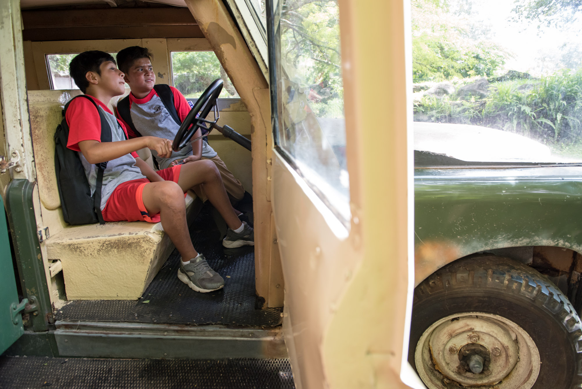 Two boys in a truck at Camp Hopetake