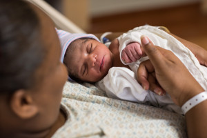 Amber Bennett holding baby Ambria Antonia Bennett in hospital bed