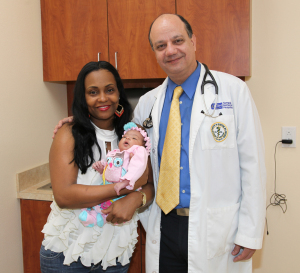 Angela Patram with her baby Rayna Simone Patram and Dr. Atef Zakhary.
