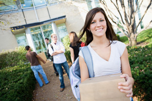 Young woman moving into college
