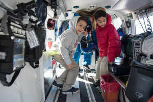 USF Patel Partnership first graders Jordan, 7, left, and Zayd, 6, check out the inside of TGH’s Aeromed helicopter.