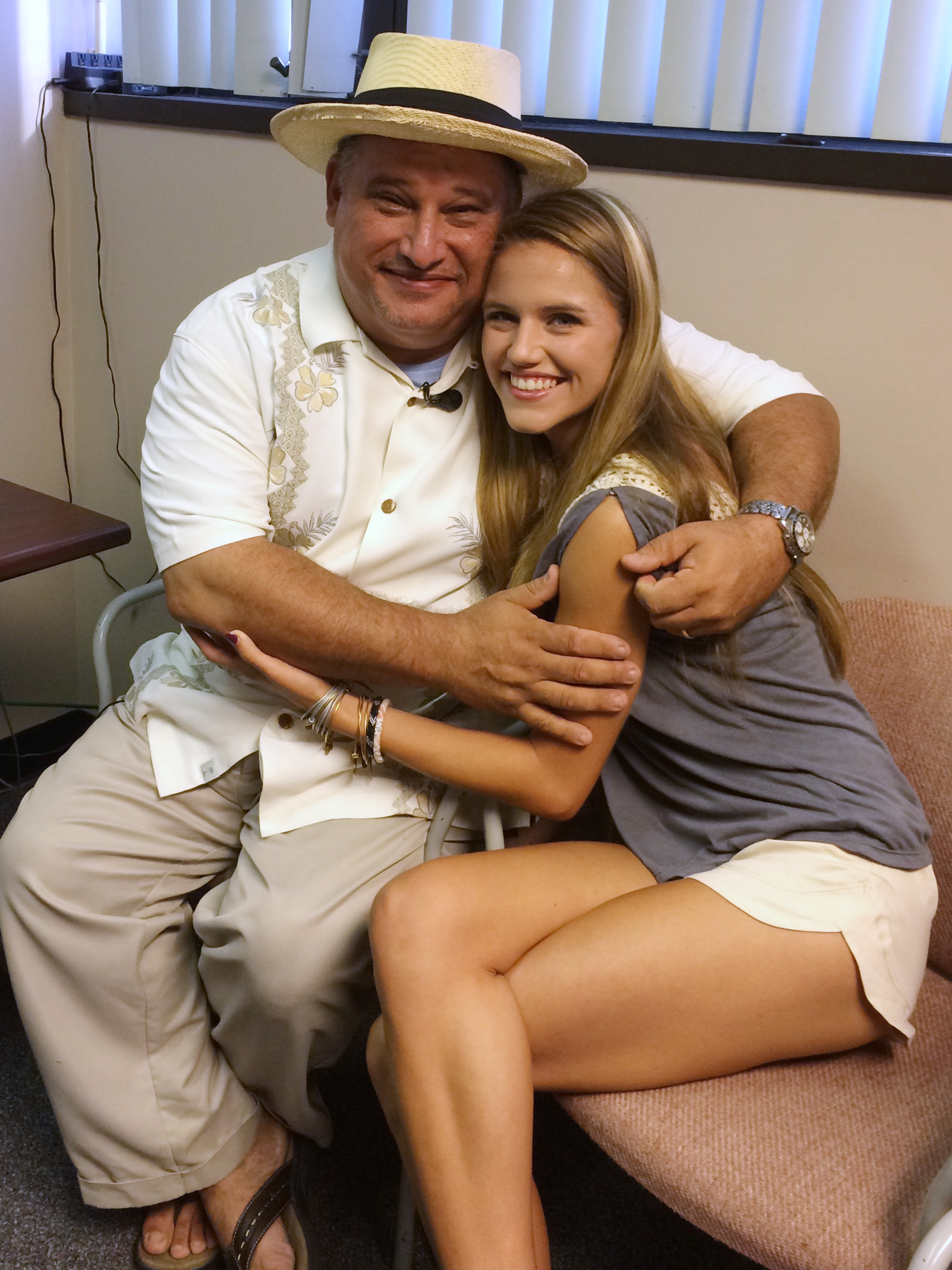 Davelis "D.C." Goutoufas and his daughter Olivia, 17, just before the process to turn on the cochlear implants begins.