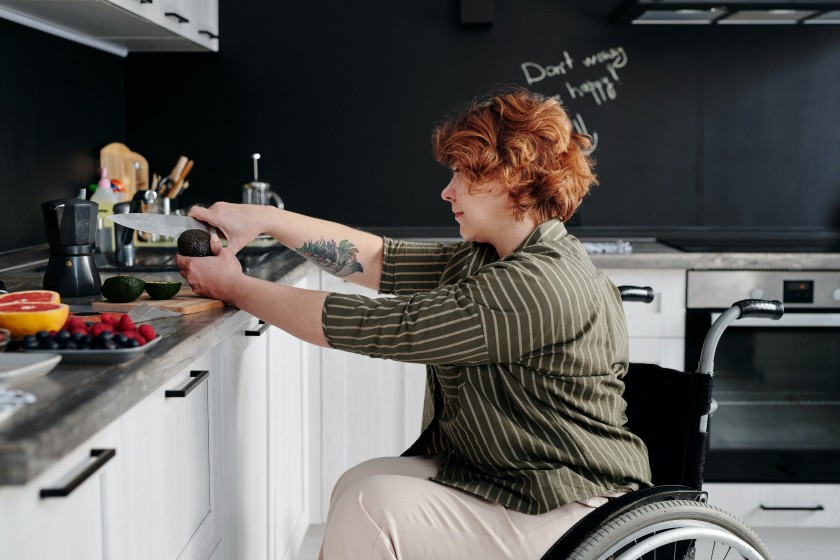 photo-of-woman-slicing-avocado-using-knife-4064411