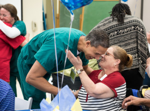 Physical therapist Steve Wesenhagen greets Juanita Martinez Gomez as former patients and the rehabilitation staff at Tampa General Hospital hold a reunion lunch.