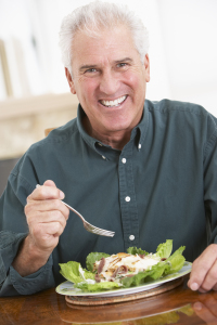 Older man eating a salad