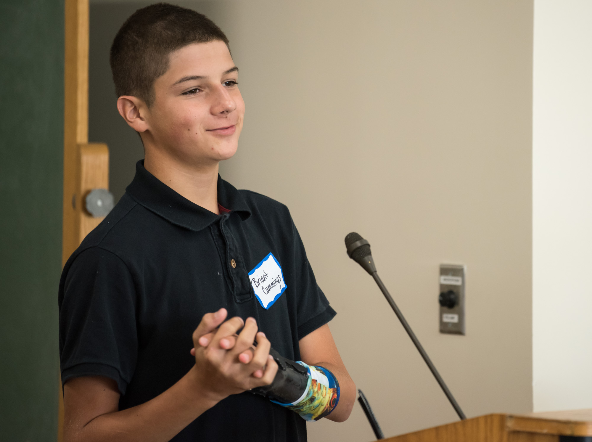 A young male patient talking at the trauma awareness luncheon