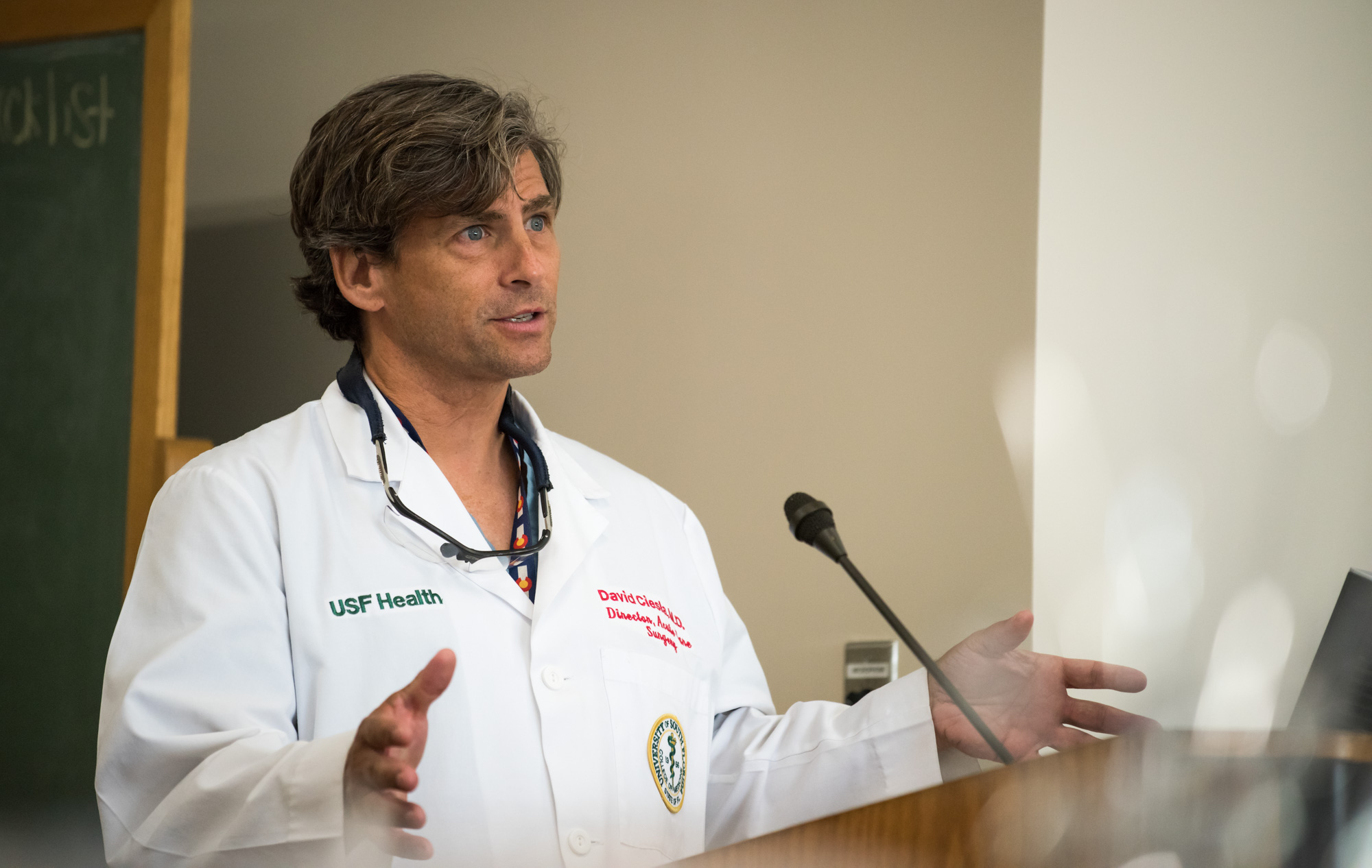 A male physician talking at the trauma awareness luncheon