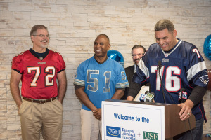 Rob Taylor, left, James Harrell and Dr. John Paul Gonzalvo listen to Brian Holloway as he shares his weight loss experience.