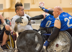 Men playing wheelchair rugby