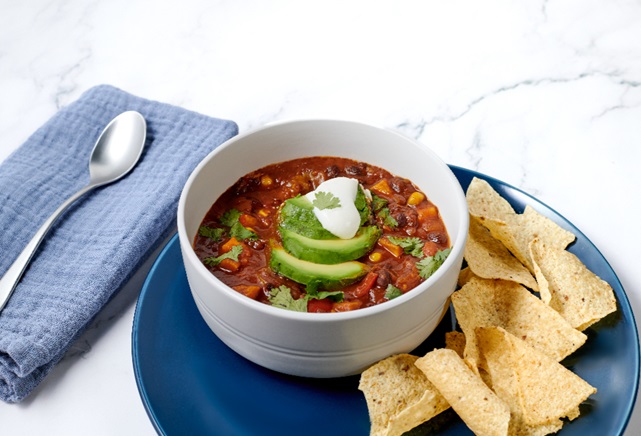 Vegetable Chili in a bowl with a side of tortilla chips from the new TGH patient menu