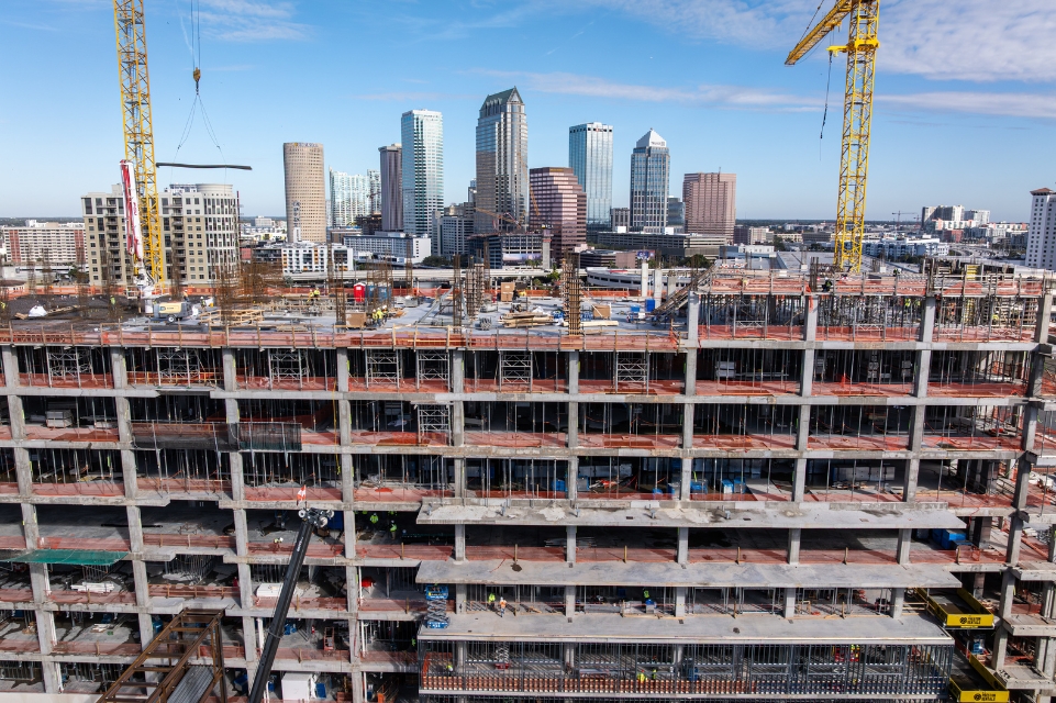 rear view of the TGH Taneja Surgical, Neuroscience & Transplant Tower under construction with Tampa skyline in background