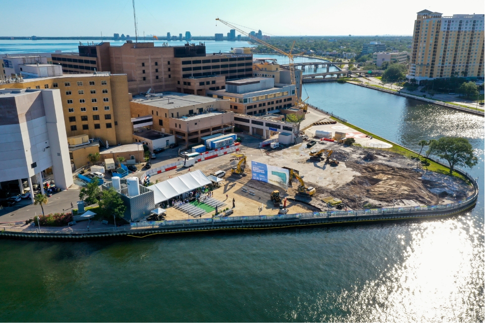 aerial view of TGH davis islands campus during the groundbreaking ceremony of the TGH Taneja Surgical, Neuroscience & Transplant Tower with waterways and Bayshore Boulevard in the background